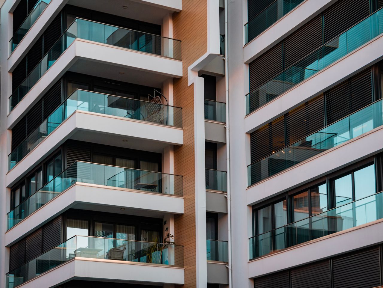 services-01 Contemporary architecture showcasing glass balconies and sleek design.